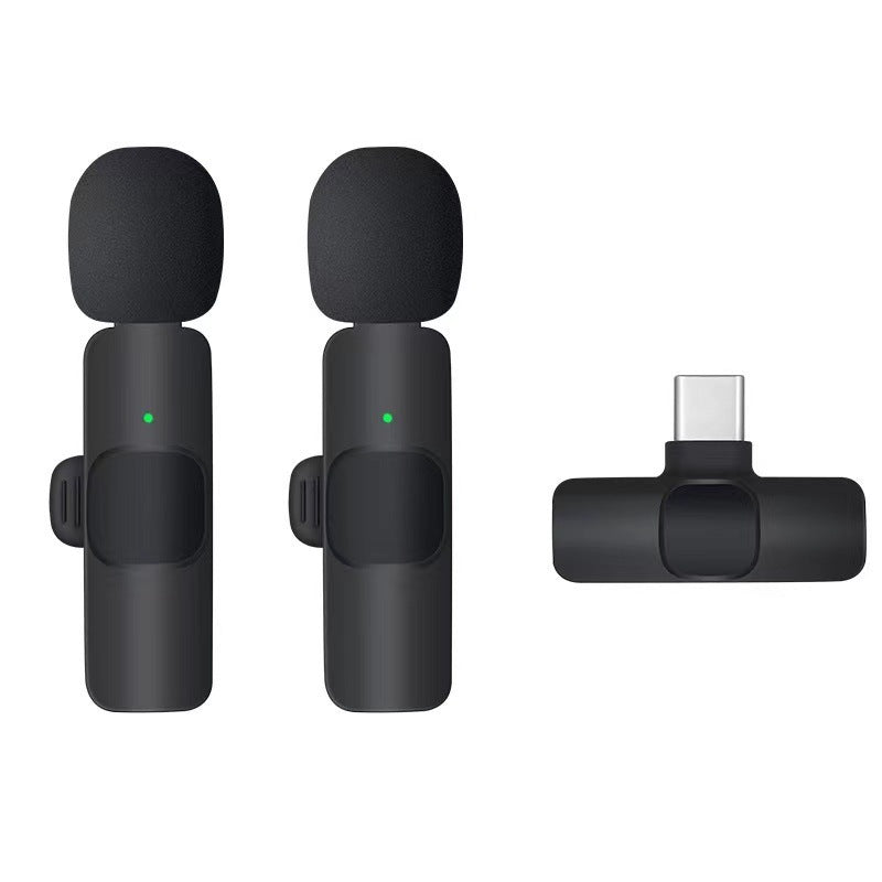 Dual wireless lavalier microphones with long-range connectivity and noise cancellation.